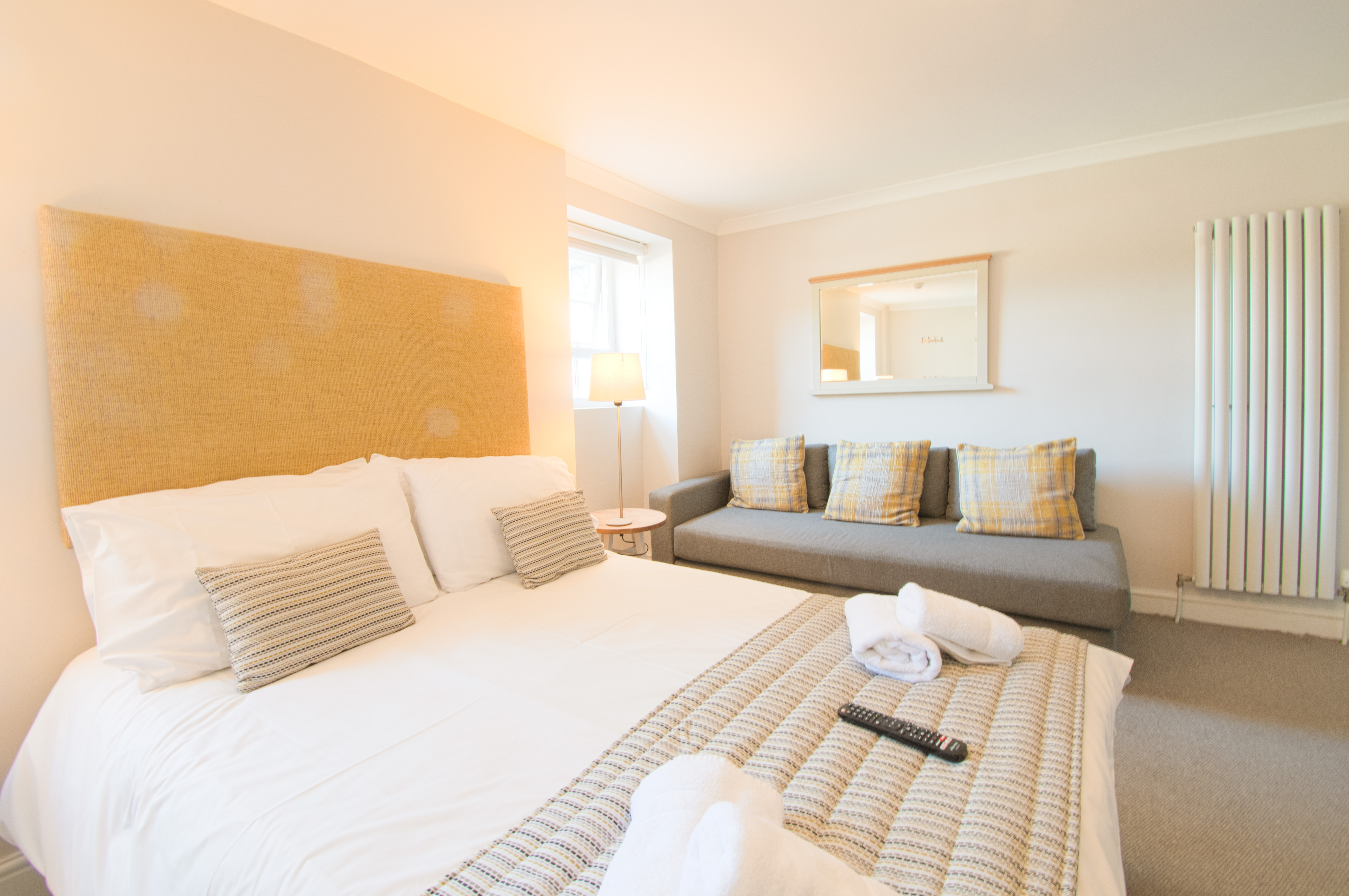 Double bedroom and sofa in Clydach family apartment