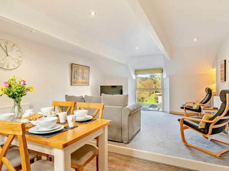 Open-plan living and dining in Winllan apartment
