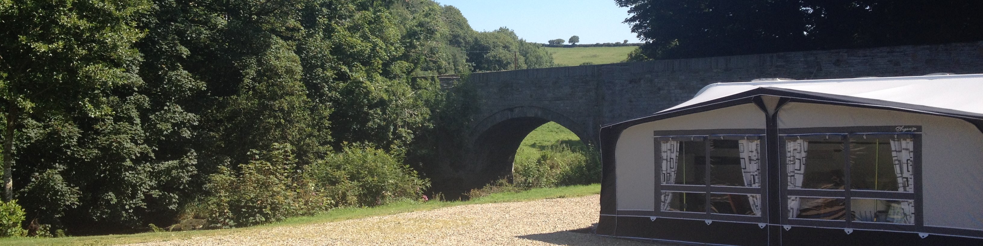 Tent near the bridge and trees